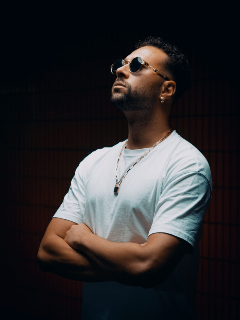 man in a dark room with sunglasses