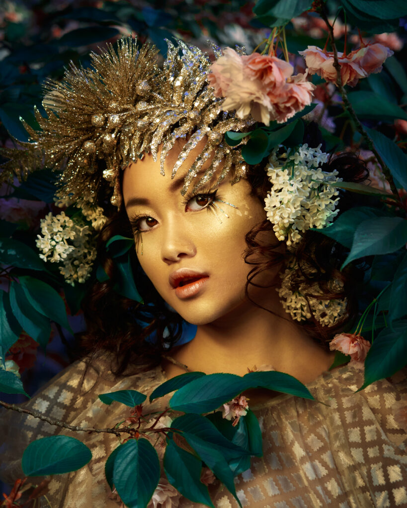 golden girl with pink rose on head