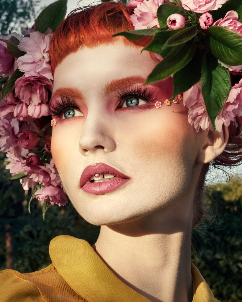 red hair girl with pink flowers on head